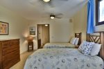 Guest twin bedroom, located on the ground floor level, below the entry. Also available as a king bed.